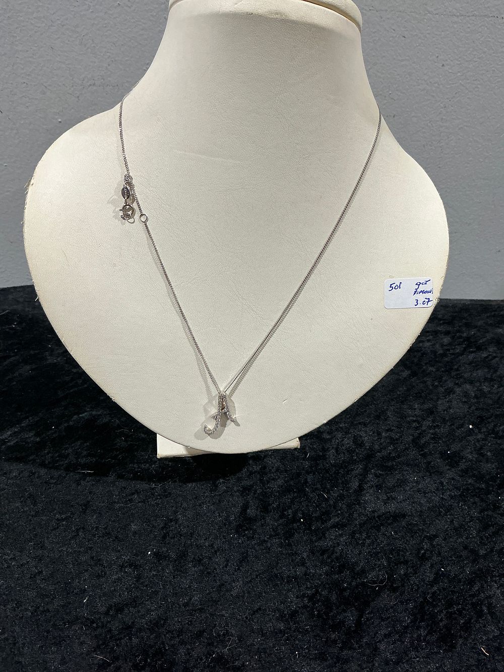 Lot 423: A 9ct White Gold and Diamond Set Initial 'A' Pendant Necklace