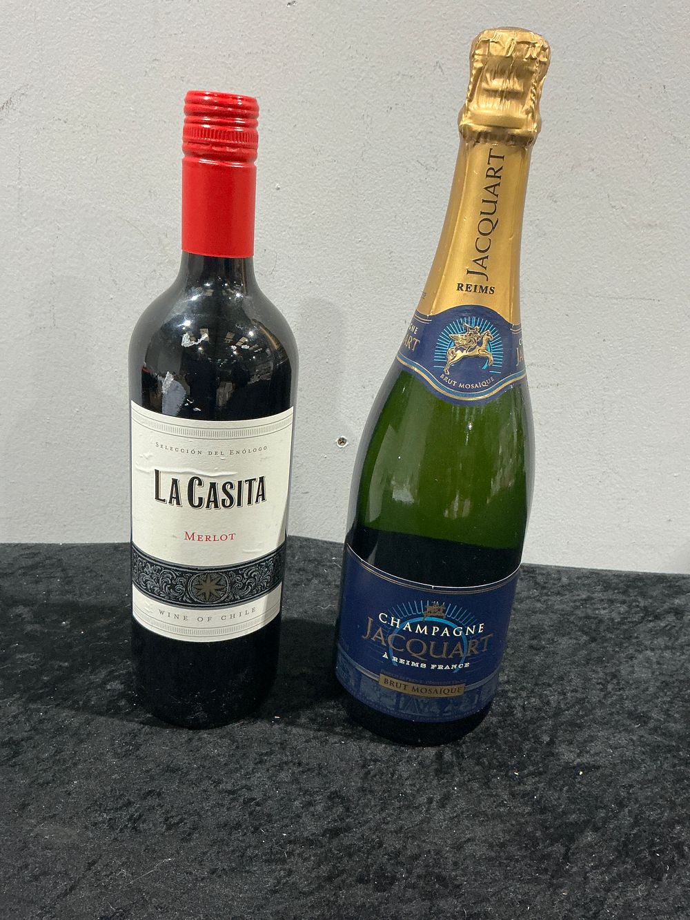 Lot 442: A Pair of Sealed Beverage Bottles, including Jacquart Brut Mosaique Champagne
