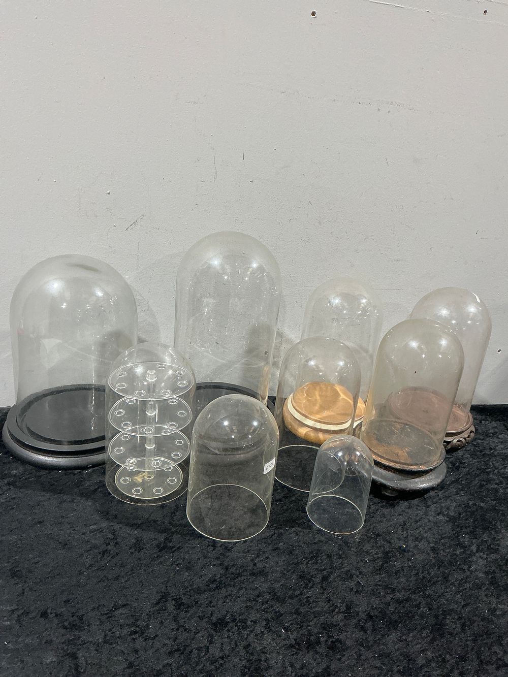 Lot 459: A Collection of 10 Assorted Clear Glass Display Domes Cloches and Display Stands