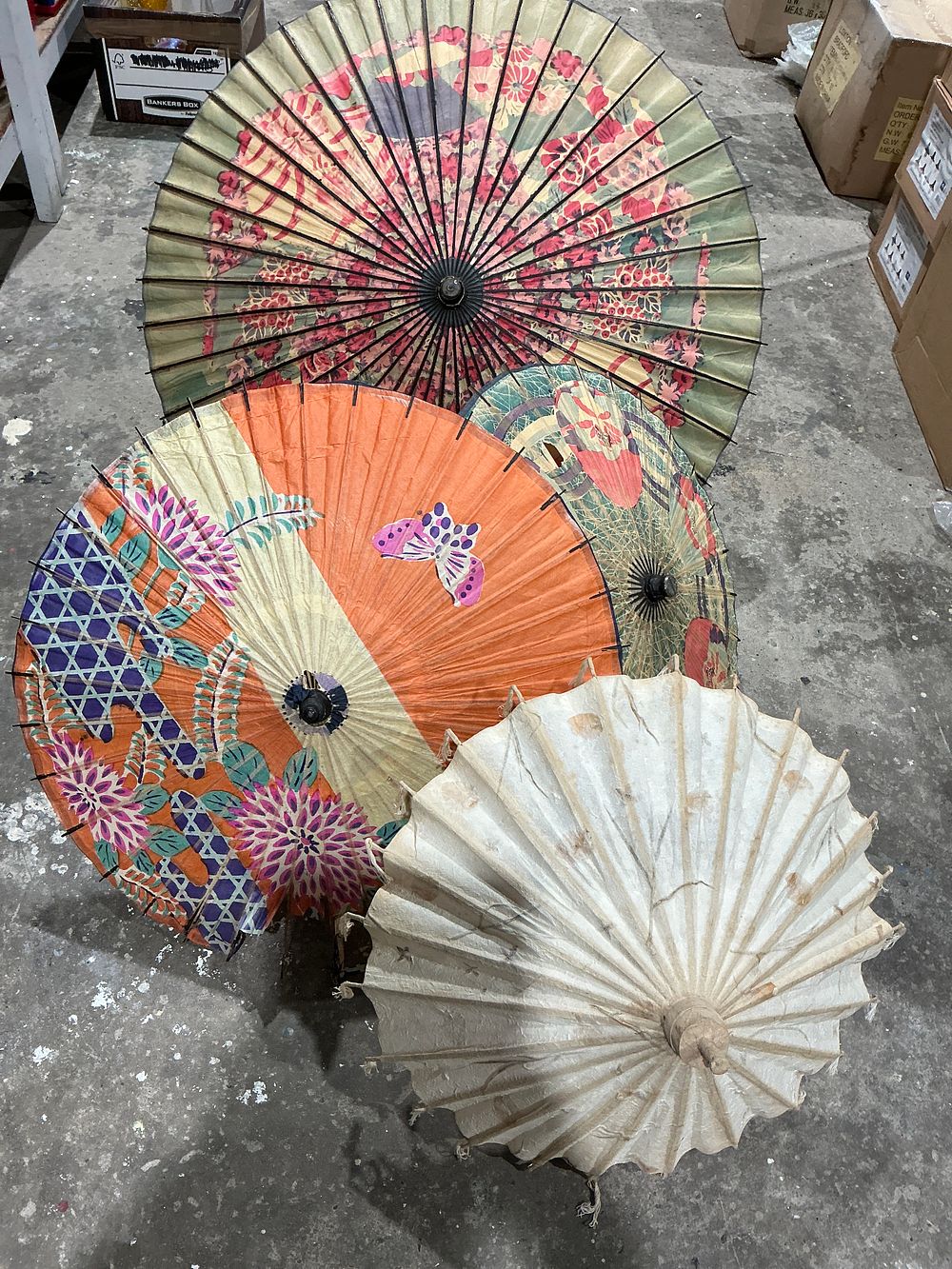 Lot 475: A Collection of 4 Vintage East Asian Hand-Painted Oil-Paper Parasols