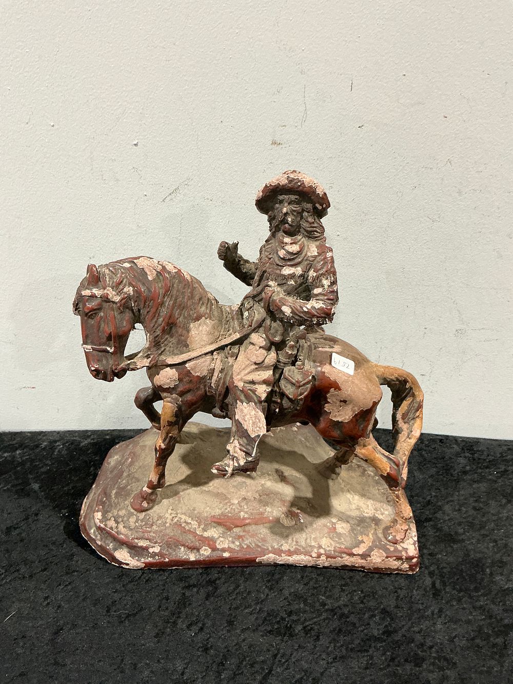 Lot 280: A Polychrome Painted Ceramic Figure of a Rider on Horseback