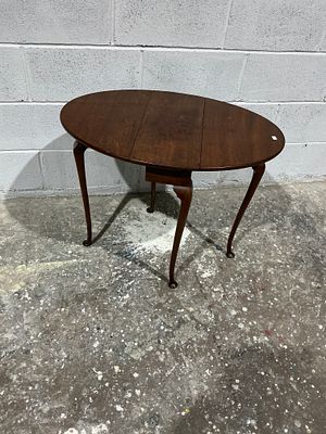 George III Style Mahogany Drop-Leaf Dining Table. A George III style mahogany drop-leaf dining 