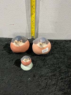 Royal Copenhagen, Three Bullfinch Figurines. A collection of three Royal Copenhagen glazed 