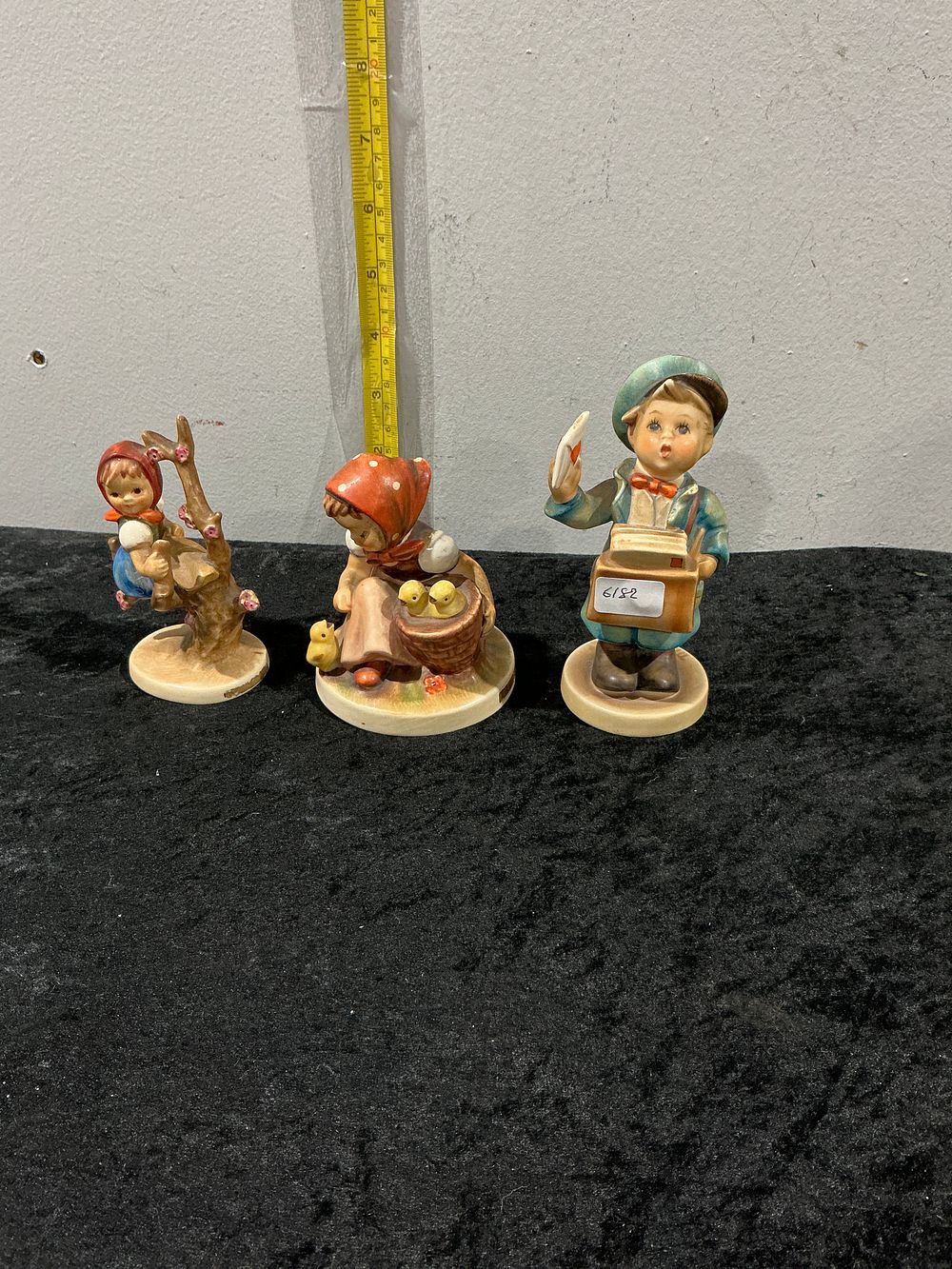 Lot 155: Goebel Hummel, Postman, Chick Girl, and Apple Tree Girl figurines