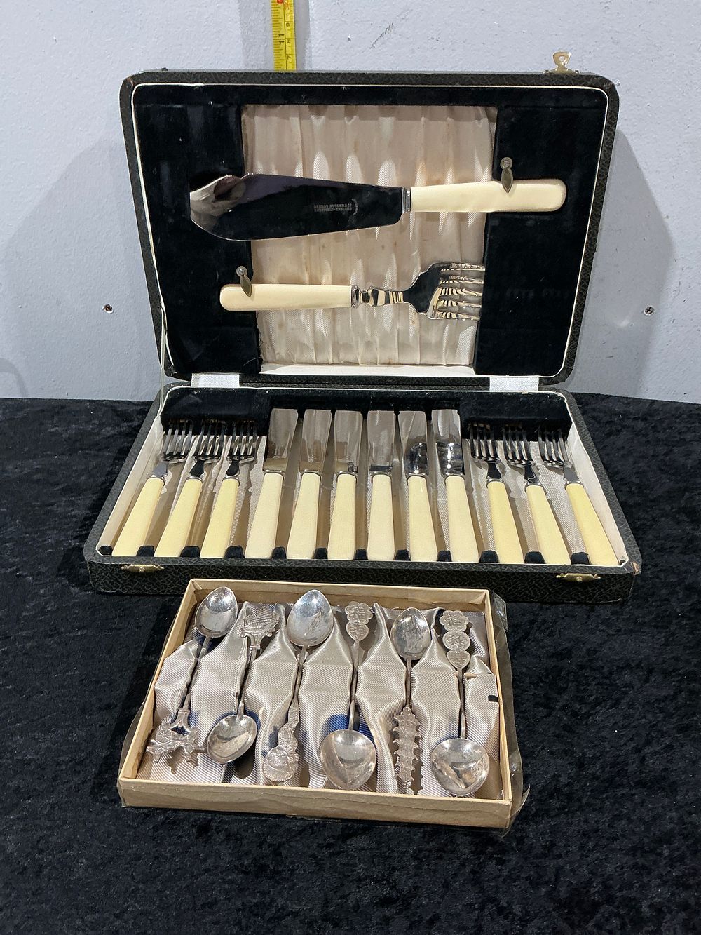 Lot 156: Chipperfield and Butler, Engraved, Cased Fish Service for Six and Souvenir Spoons, Silver Plate and Ivorine
