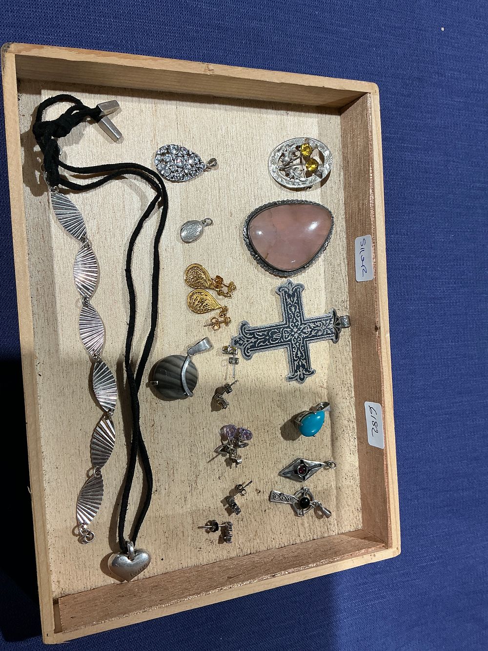 Lot 204: A collection of assorted silver jewellery featuring a large pink cabochon pendant and fan-link bracelet