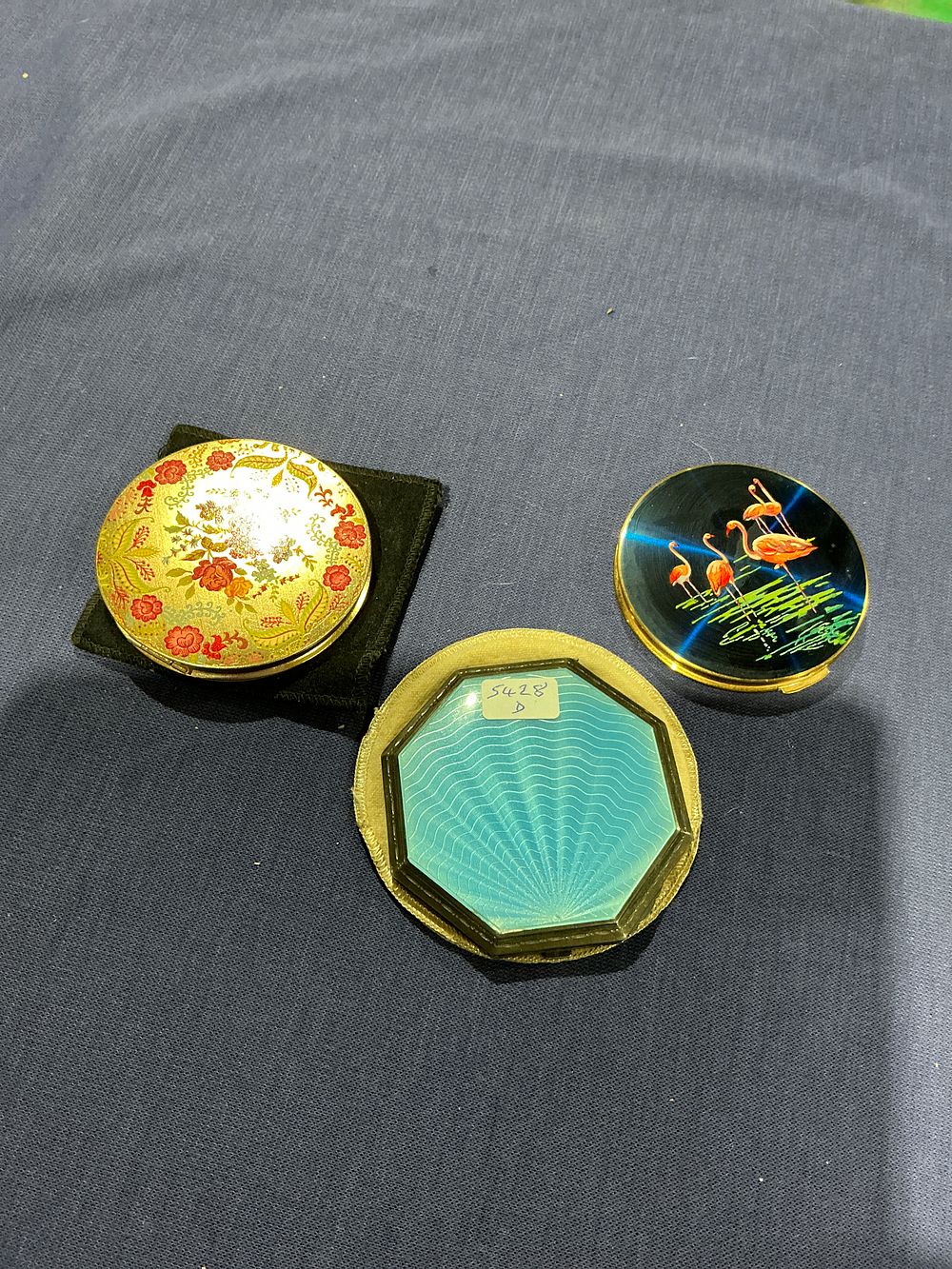 Lot 232: Various Makers, Mid-Century Vanity Collection, Gold-Tone Metal, Guilloché and Pictorial Enamel compacts
