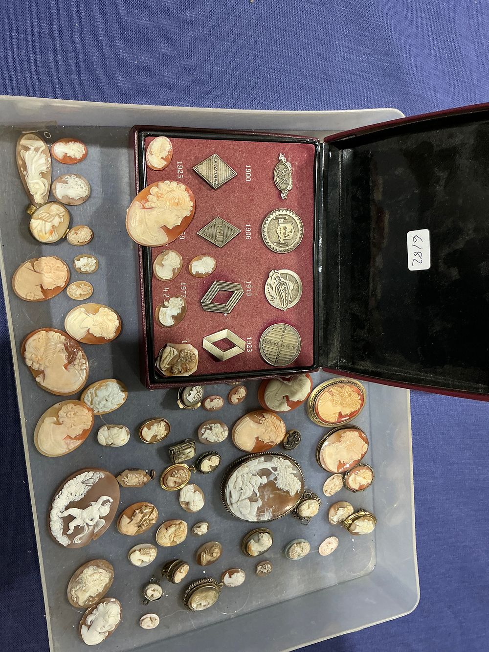 Lot 243: Renault Commemorative Logo Badge Presentation Set 1900-1992 and Large Collection of Carved Shell and Stone Cameos
