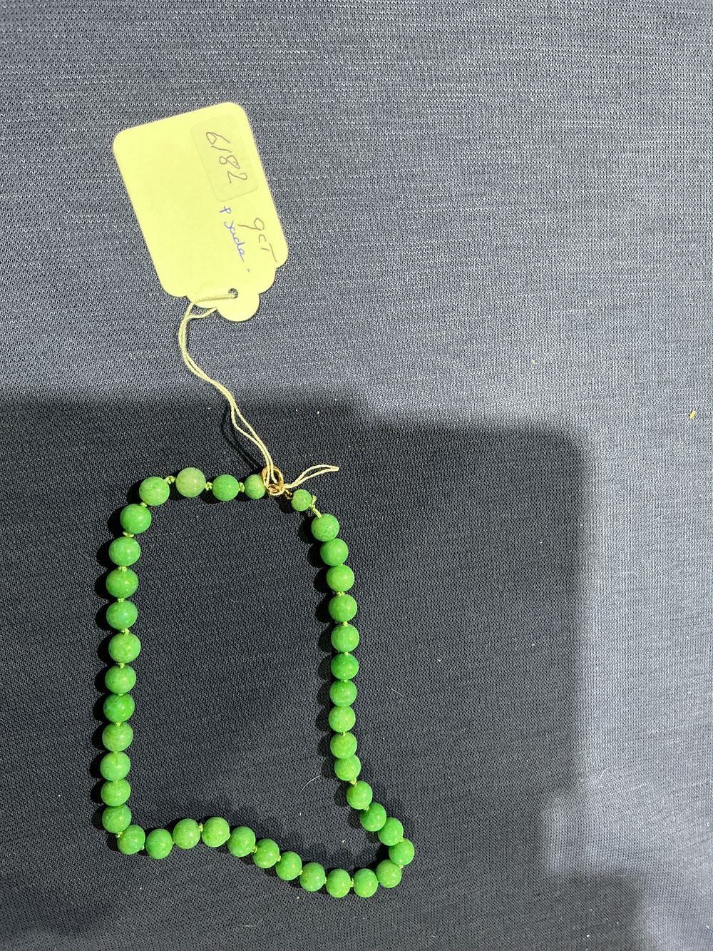 Lot 309: 9ct Yellow Gold and Green Jade Bead Necklace