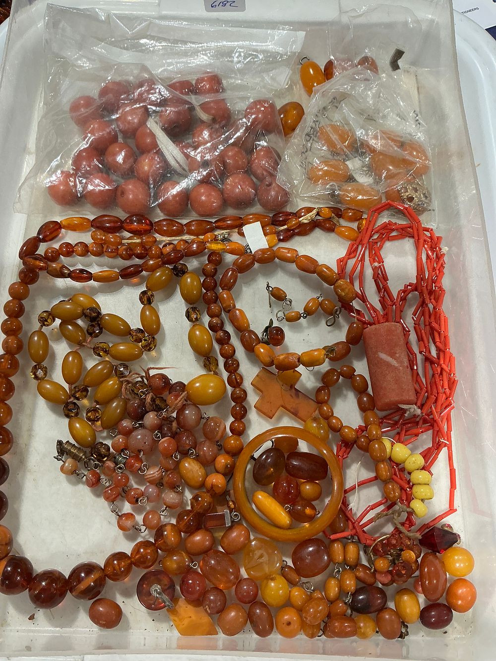 Lot 325: Base metal and mixed material jewellery collection featuring amber, coral, and agate beads