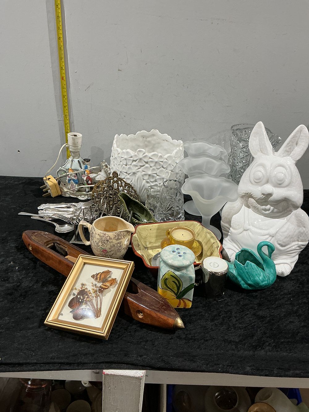 Lot 351: A Diverse Collection of Decorative Arts including a Large Ceramic Rabbit, Glassware, and Industrial Weaving Shuttles
Category: Ceramics