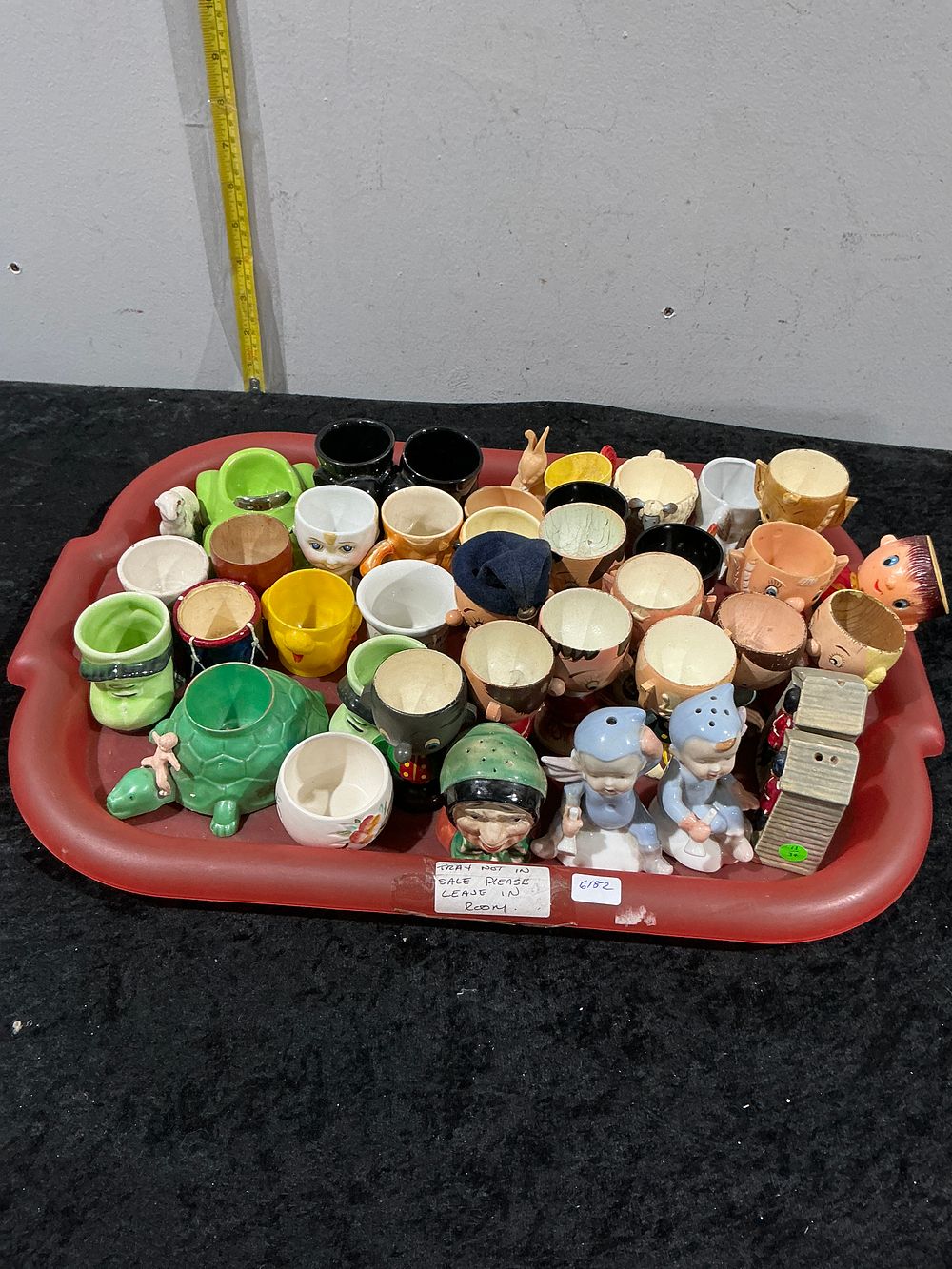 Lot 352: A Large Collection of Mid-Century Novelty Ceramic Egg Cups and Kitchenware
