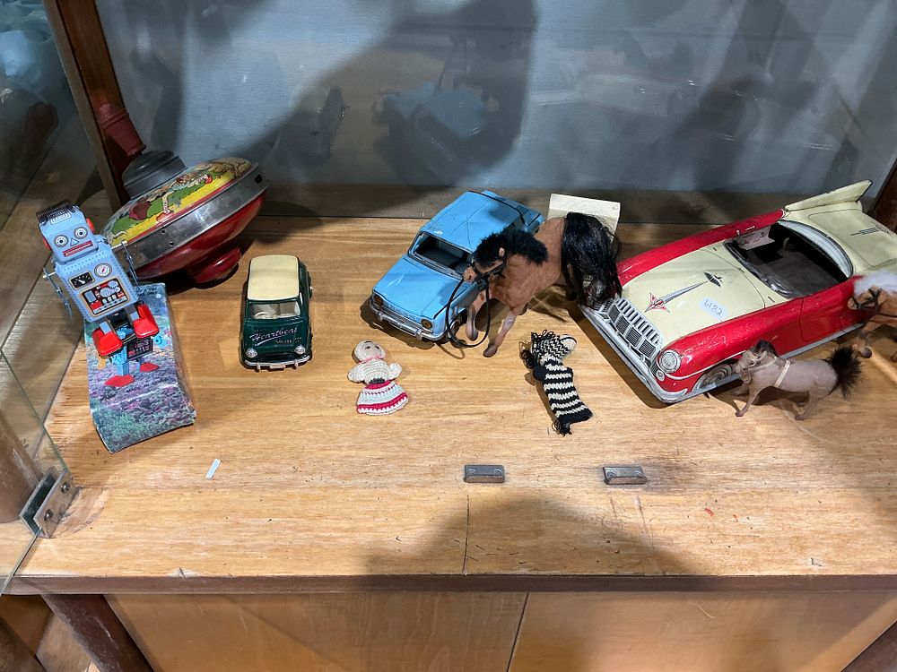 Lot 397: Garton Style and Chinese Manufacturers, Collection of Vintage and Modern Tinplate Toys and Figurines, Including Kidillac Style Convertible and Boxed Robot, Mid to Late 20th Century