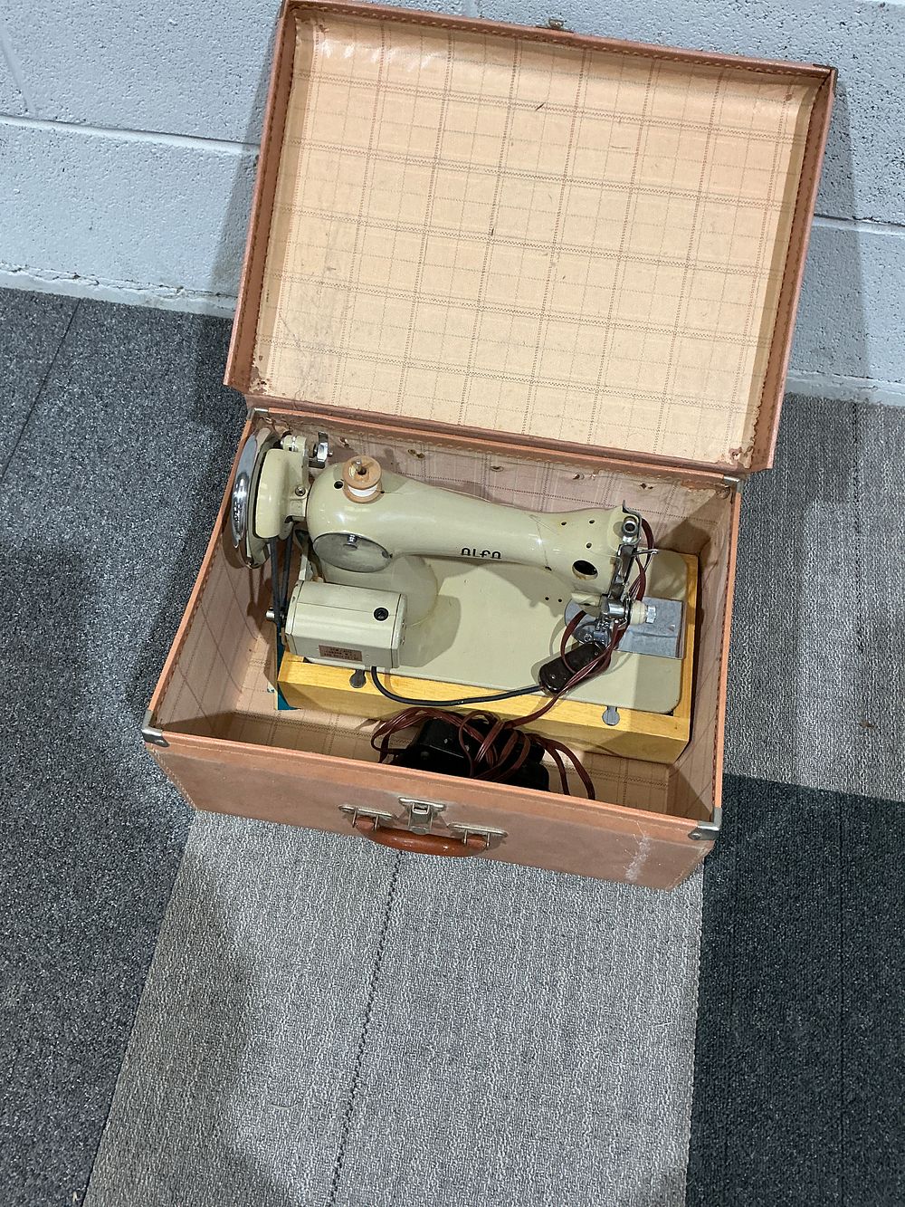 Lot 197: ALFA Portable Electric Sewing Machine in Original Pink Carrying Case, Mid-20th Century