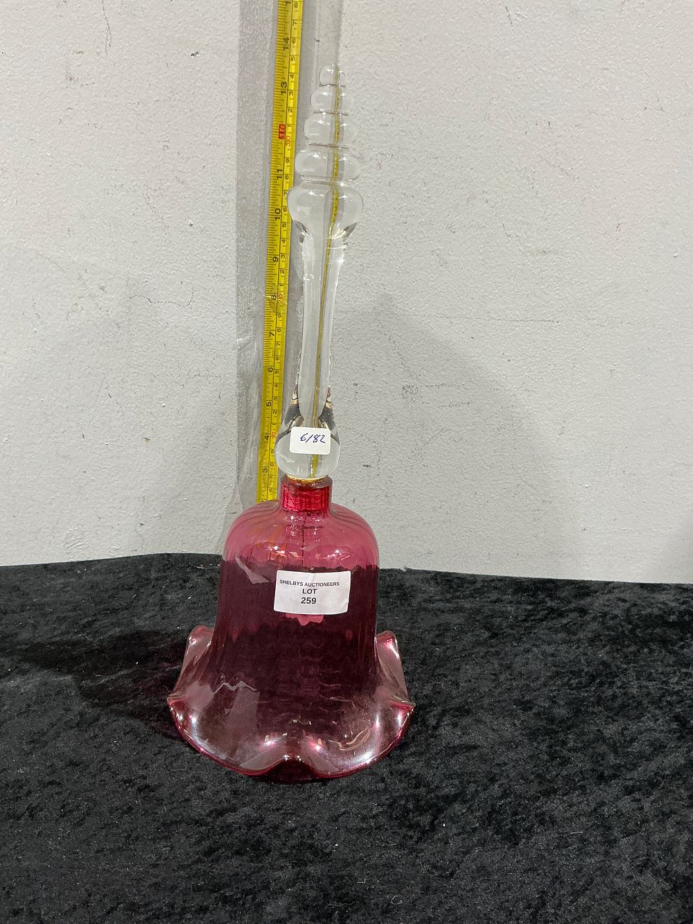 Lot 259: A Victorian Cranberry Glass Decanter with Ruffled Base and Clear Glass Stopper