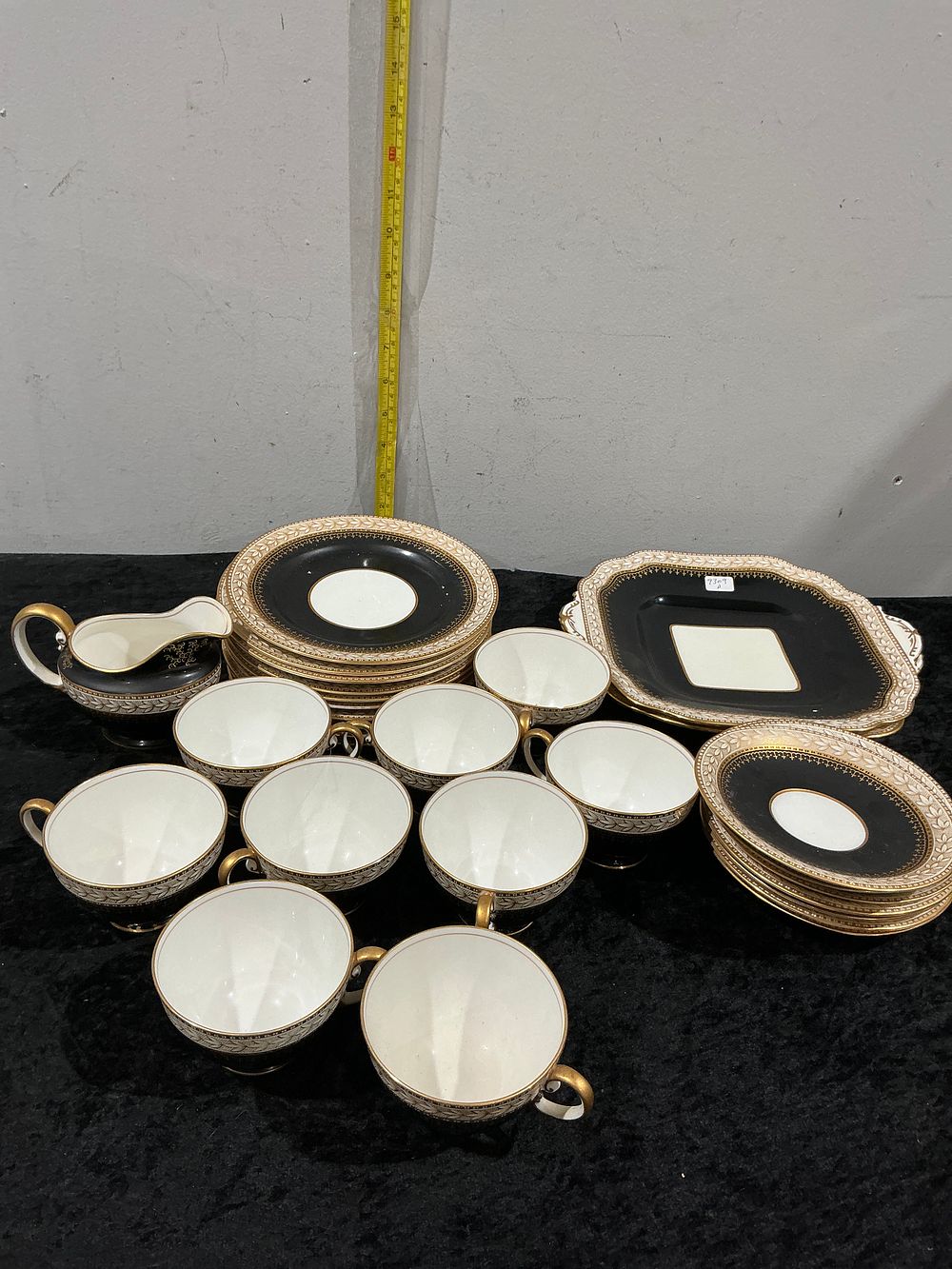 Lot 269: An Aynsley Bone China Partial Tea Service Pattern A3680 with Black and Gilt Decoration