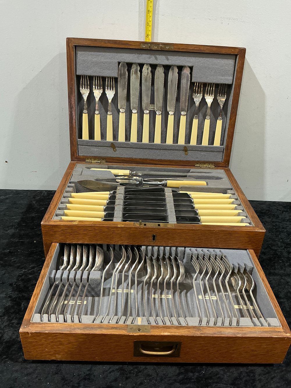 Lot 218: An Elkington & Co Silver-Plated Canteen of Cutlery in a Two-Tier Oak Case