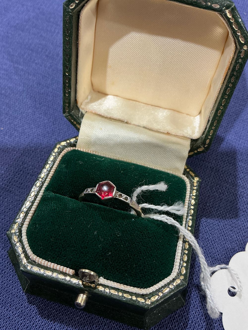 Lot 272: A 9ct white gold ruby and diamond inset ring