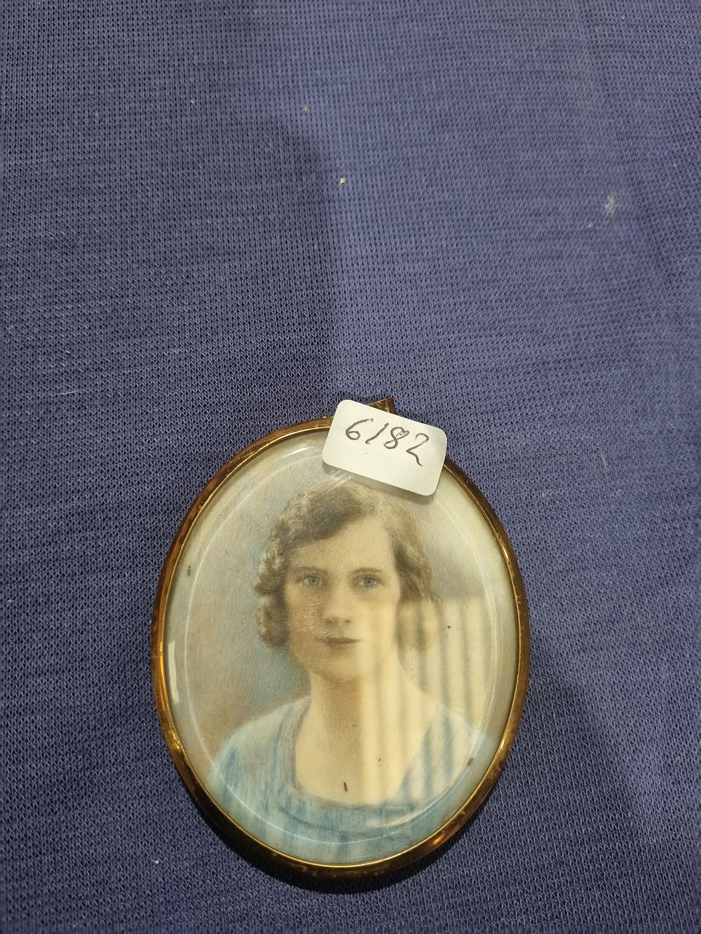Lot 310: Early 20th-century oval portrait miniature of a young woman