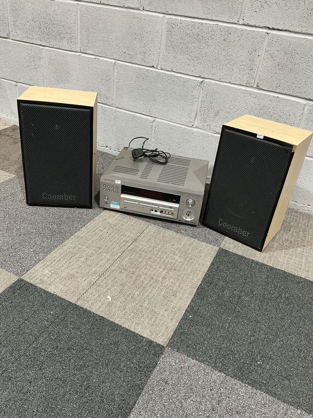 Lot 179: A Pioneer VSX-324 Multi-Channel Receiver and a Pair of Coomber Model 415 Loudspeakers