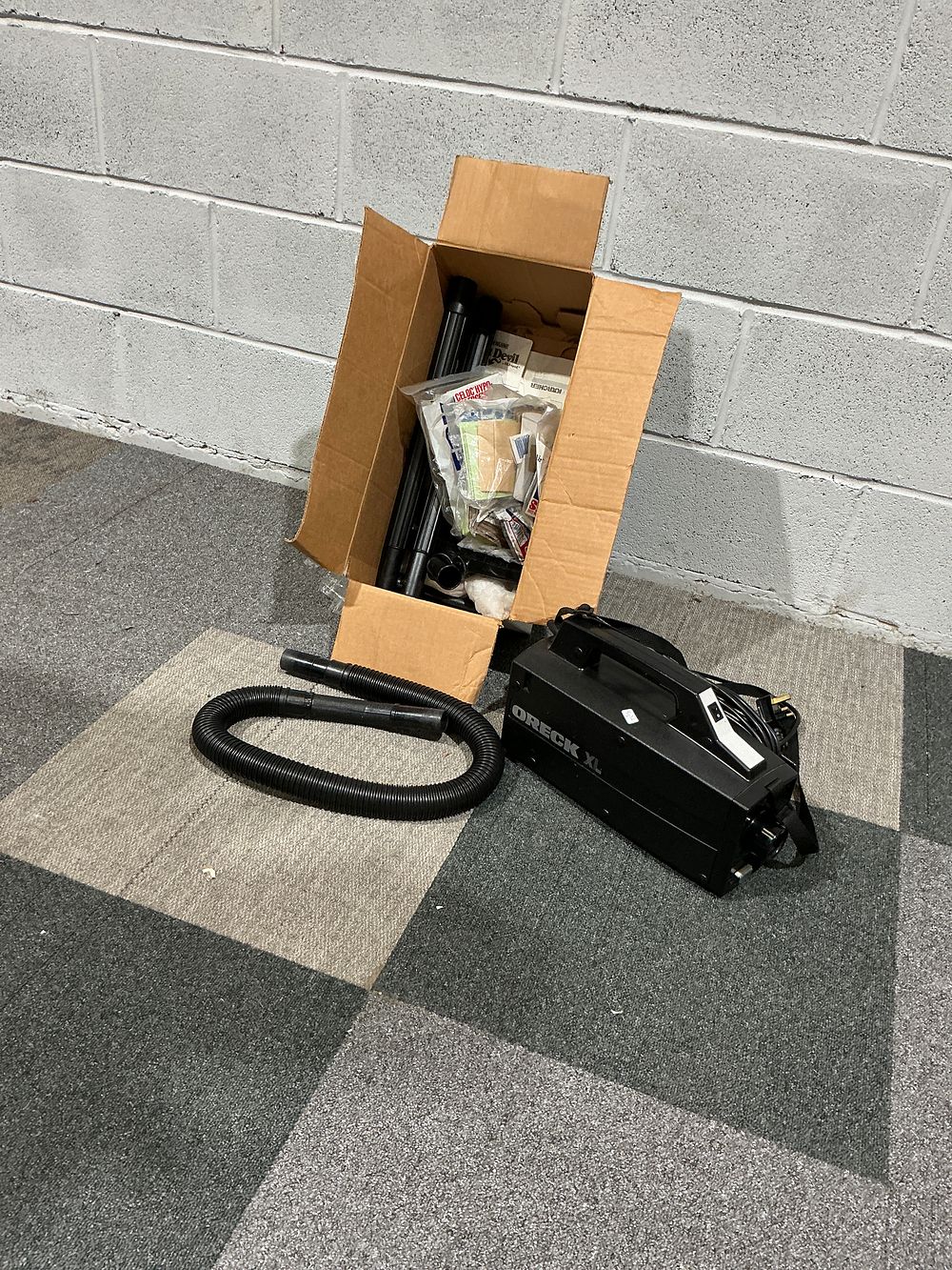 Lot 180: Oreck XL Portable Handheld Vacuum Cleaner with Accessories