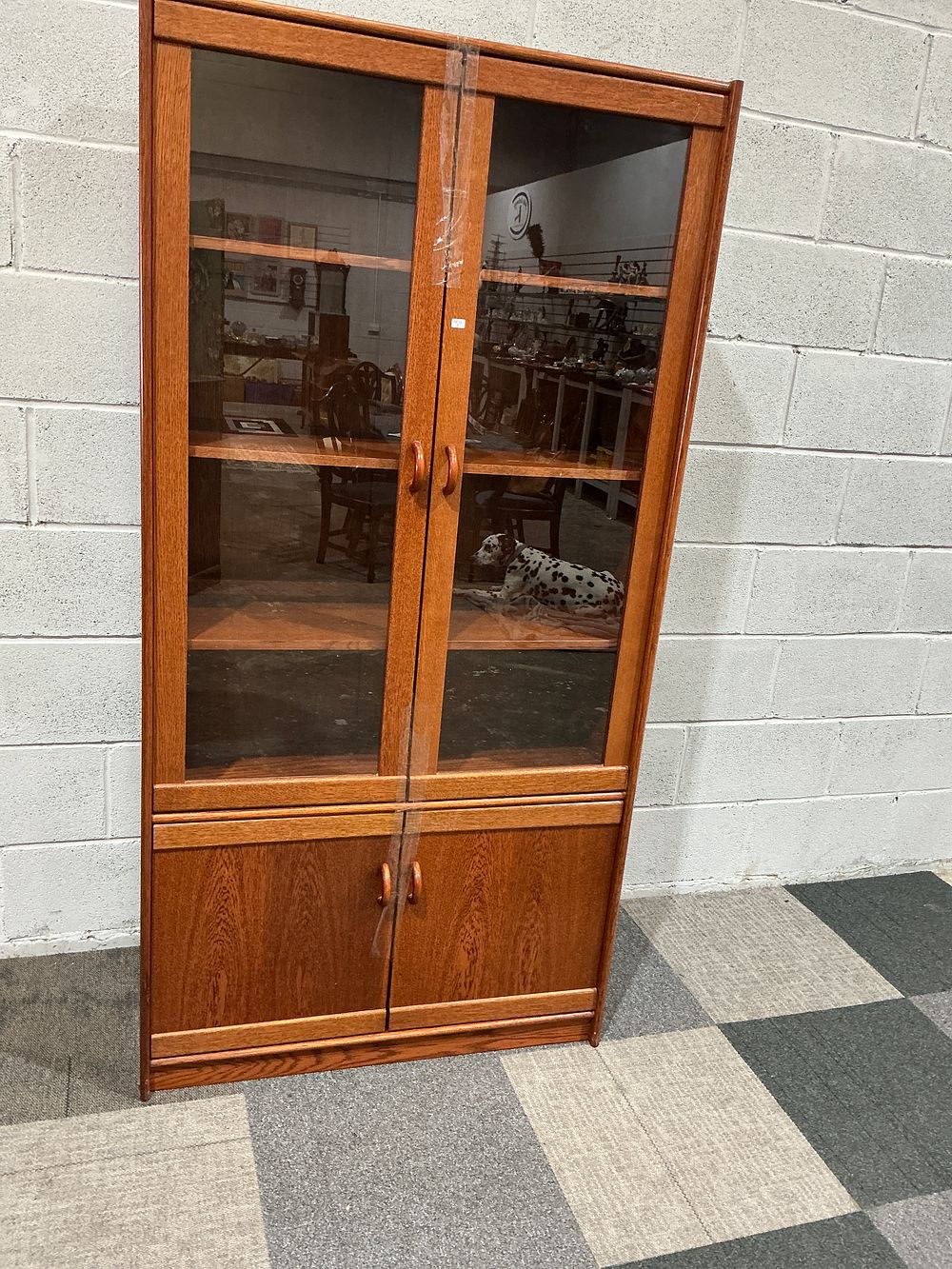 Lot 208: A Mid-Century Modern Teak Veneer Two-Piece Display Cabinet