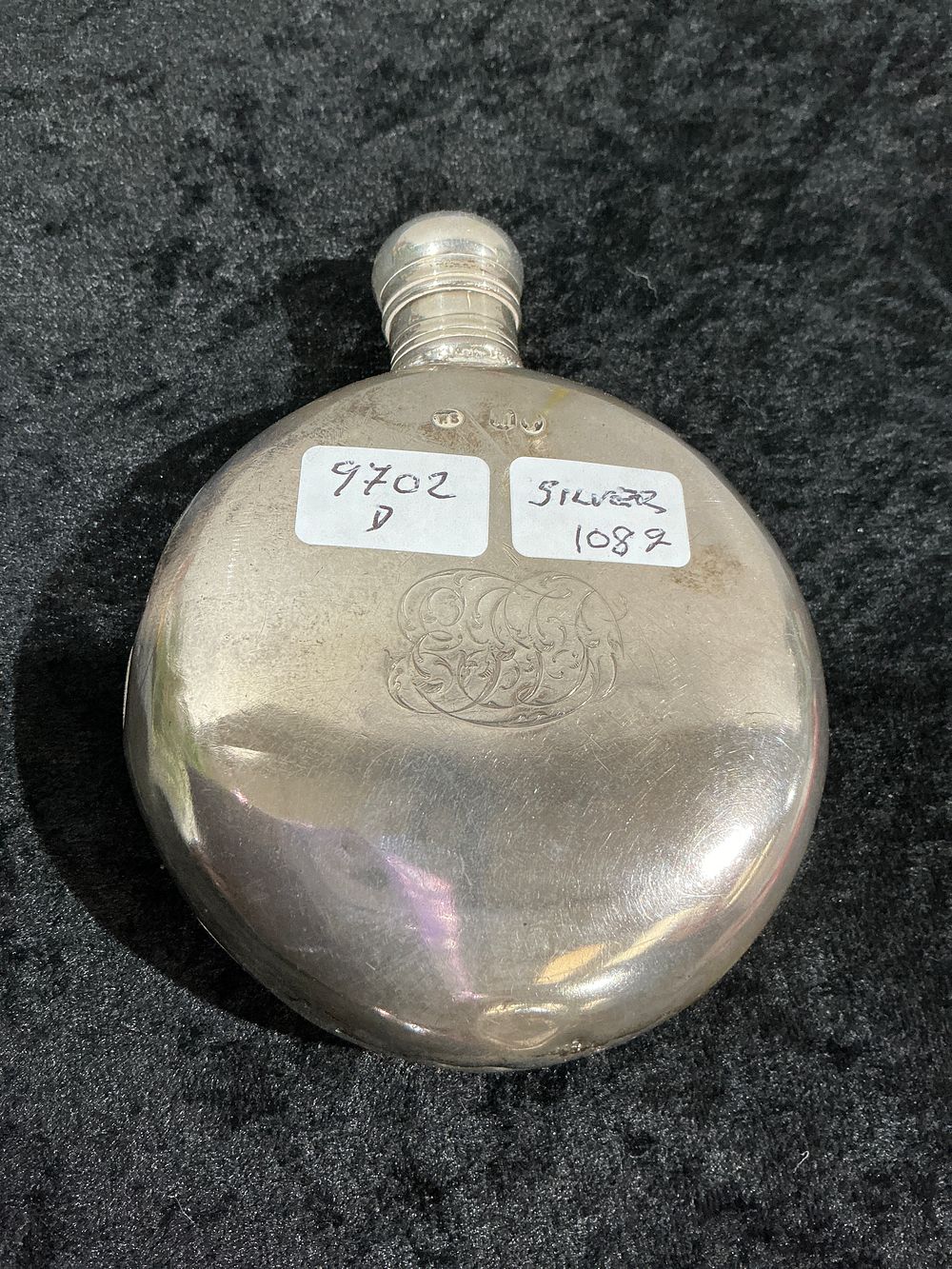 Lot 253: An Edwardian Sterling Silver Circular Hip Flask, Thomas Smith and Sons, Birmingham, 1905