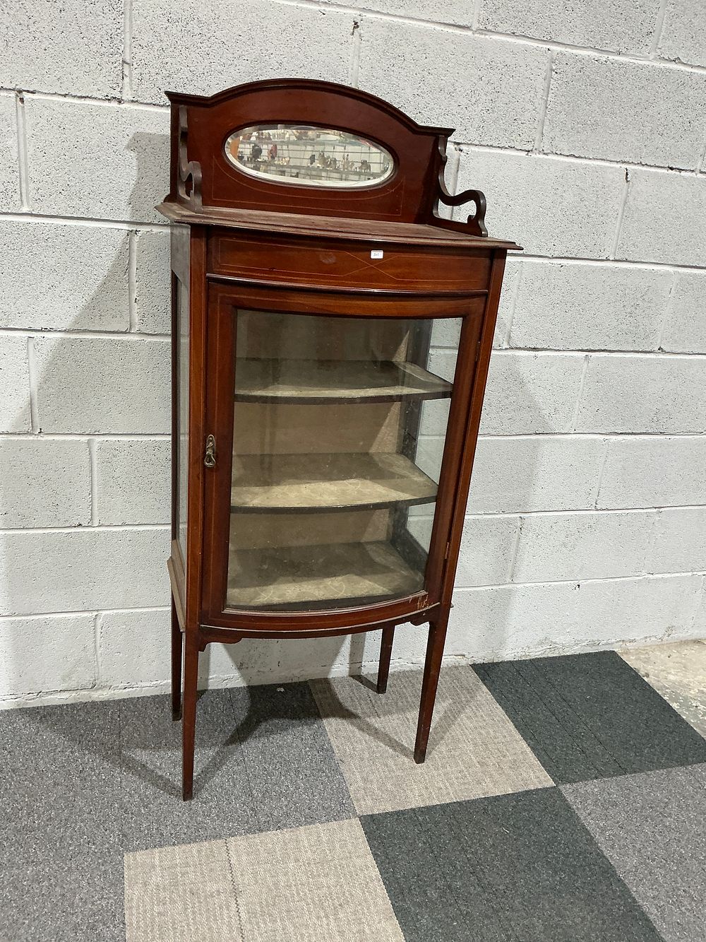 Lot 15: An Edwardian Sheraton Revival Inlaid Mahogany Bow-Fronted Display Cabinet