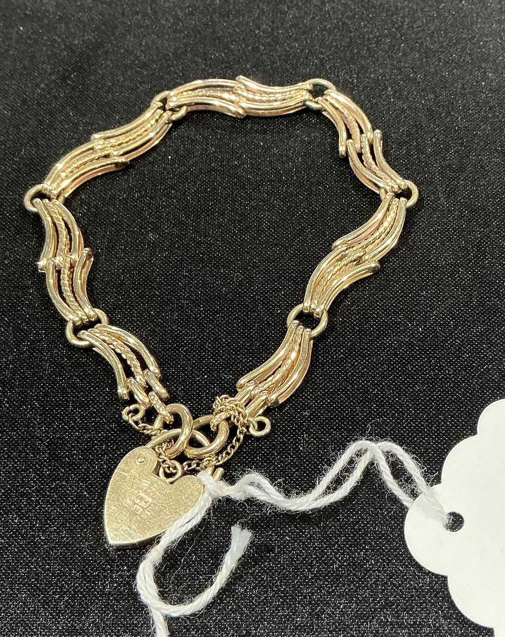 Lot 153: A 9ct Yellow Gold Gate Link Bracelet