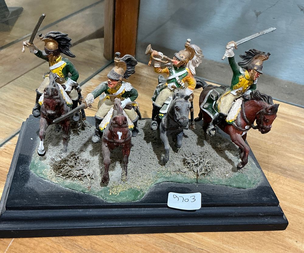 Lot 244: A Group of Hand-Painted Napoleonic French Chasseurs à Cheval Miniature Cavalry Figures on a Display Plinth