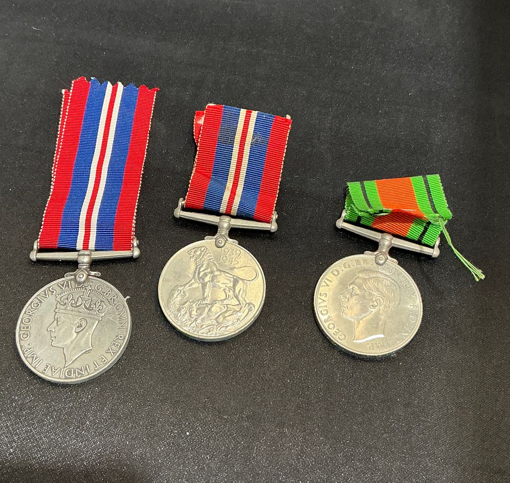 Lot 296: A Trio of British World War II Campaign Medals comprising a Defence Medal and Two War Medals 1939-1945