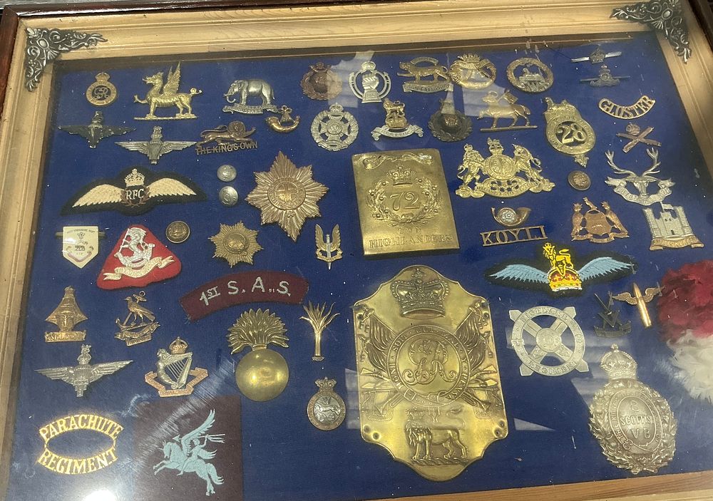 Lot 297: A Collection of British and Commonwealth Military Insignia, Badges, and Plates