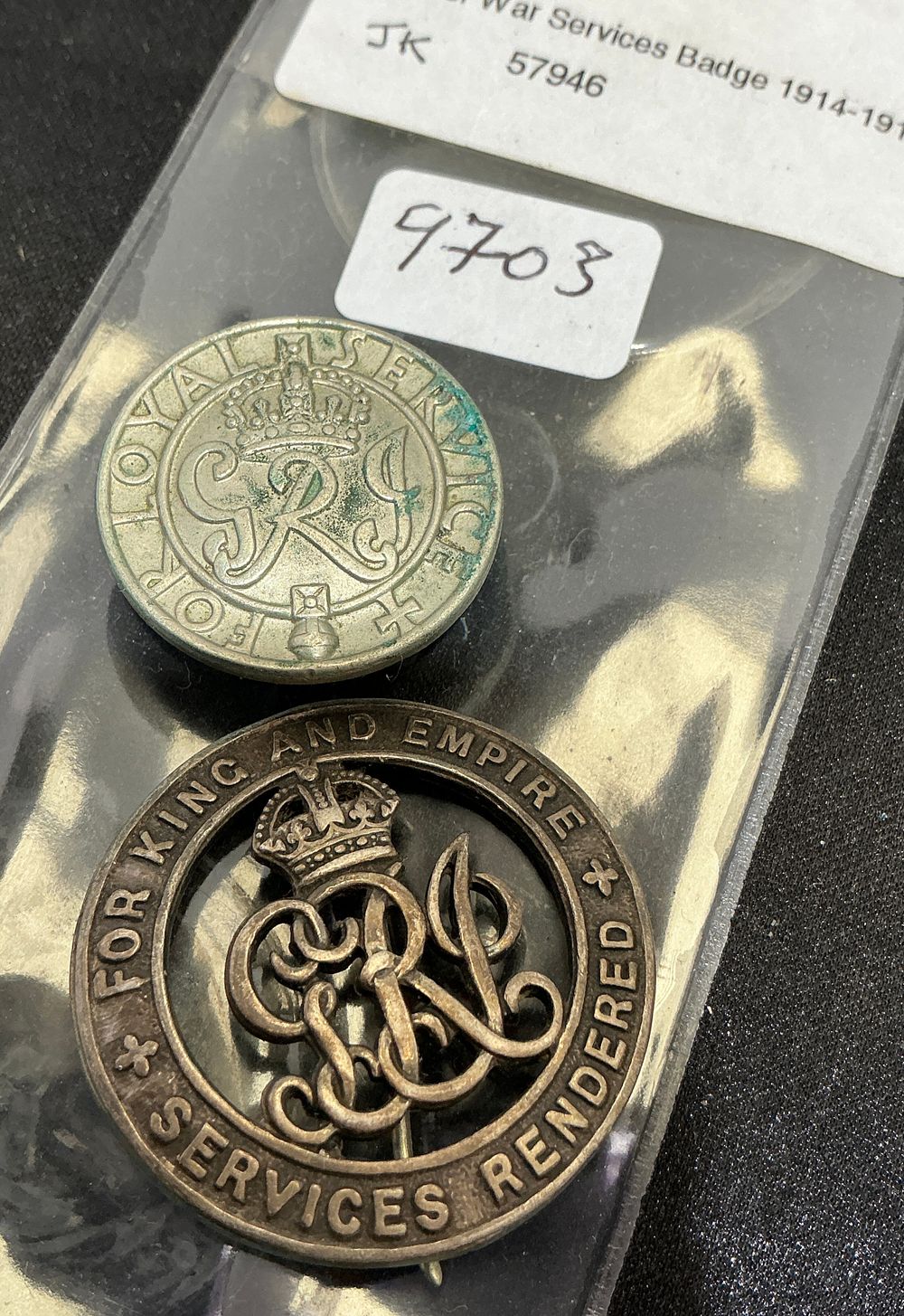 Lot 368: Two British Military Discharge Badges from the First and Second World Wars