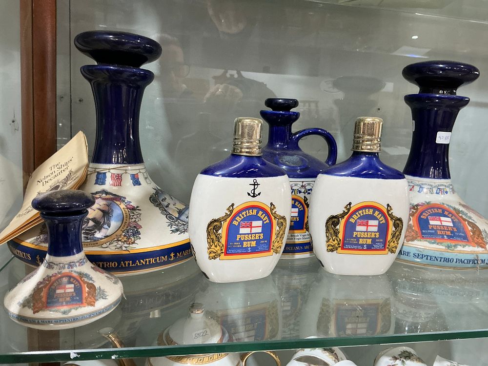 Lot 234: A Collection of Six British Navy Pusser's Rum Ceramic Decanters and Bottles