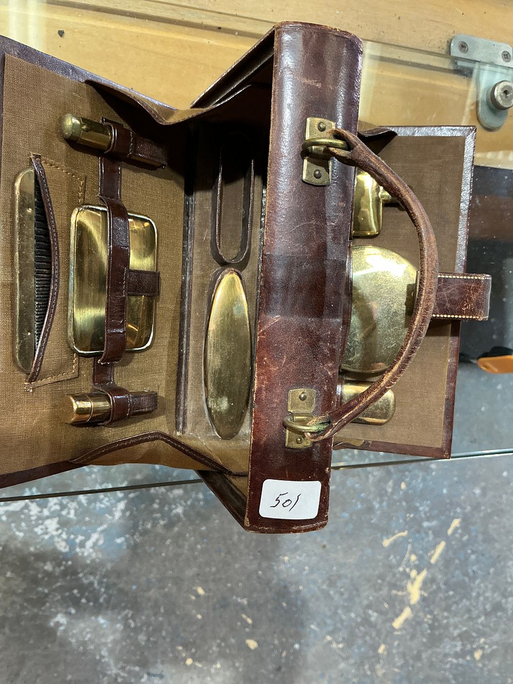 Lot 248: Early 20th-century Gilt-Tooled Leather Travel Dressing Set