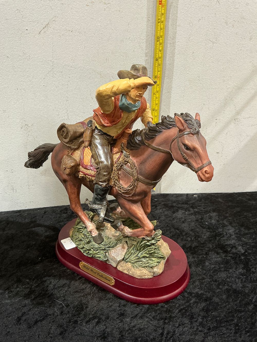 Lot 265: A Polychrome Composite Figurine of a Cowboy on a Rearing Horse, Wild West Collection