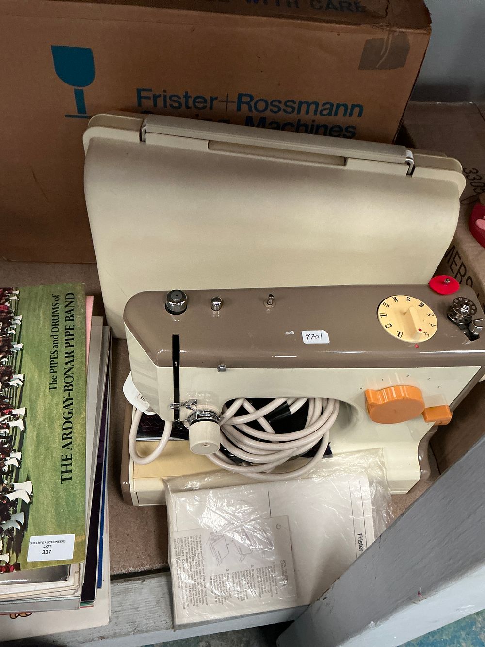 Lot 338: Two items comprising a Frister + Rossmann sewing machine and a vinyl record