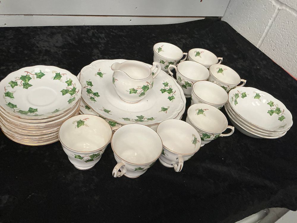 Lot 357: A Set of Bone China Tea and Dessert Wares in the Ivy Leaf Pattern, Attributed to Colclough