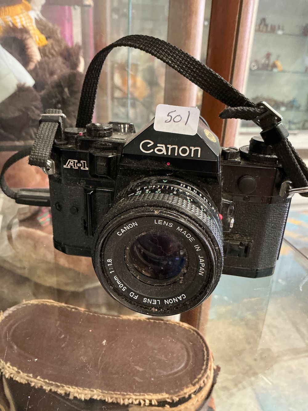 Lot 287: Canon A-1 35mm SLR Film Camera with Canon FD 50mm f/1.8 Lens