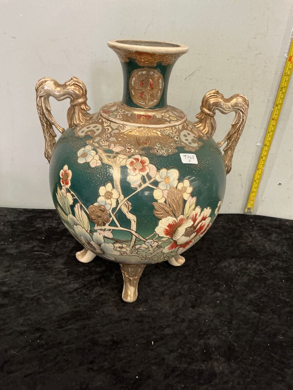 Lot 296: A pair of Japanese Satsuma style earthenware four-footed vessels with gilt handles
