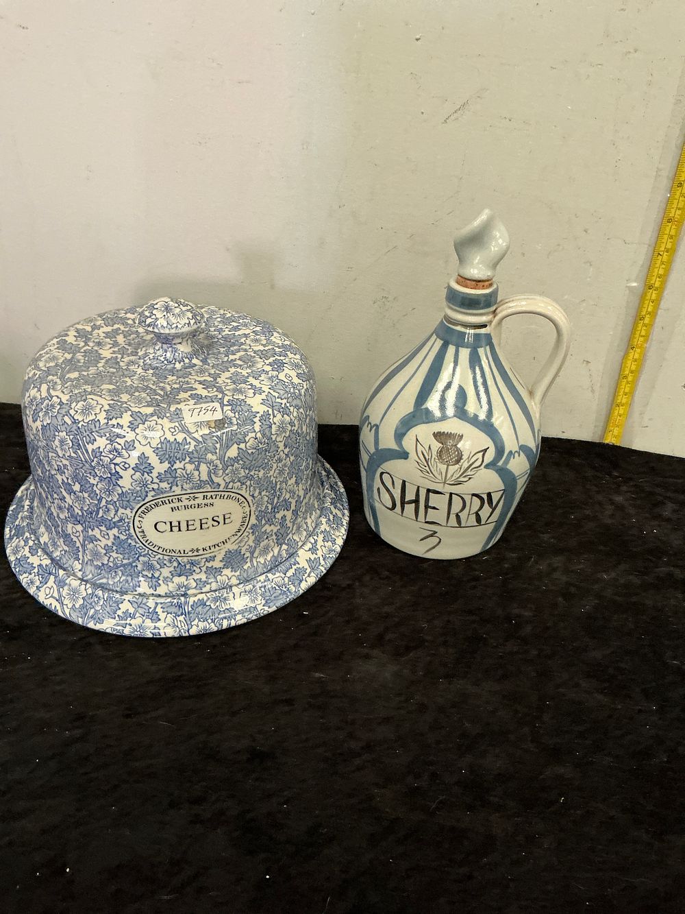 Lot 337: Two items of blue and white ceramic kitchenware comprising a Frederick Rathbone Burgess cheese dome and a Sherry flagon