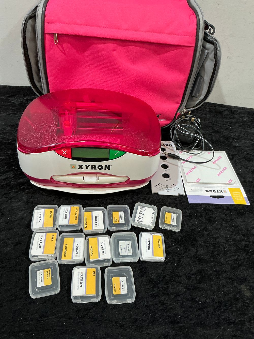 Lot 196: A Xyron Design Runner Handheld Printer and a Collection of Crafting Accessories