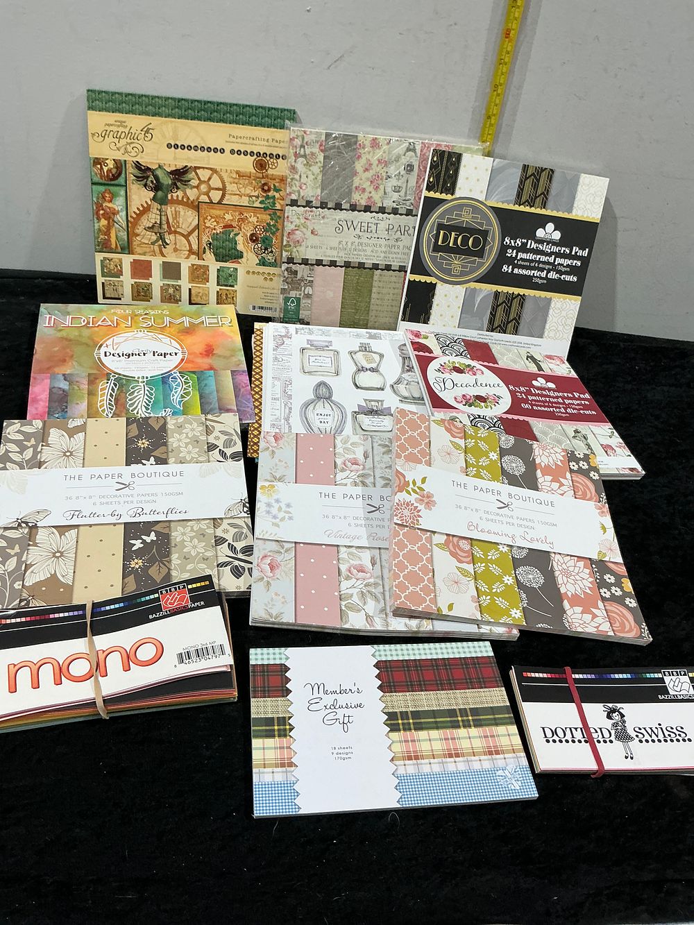 Lot 215: An Assortment of Professional Scrapbooking and Papercrafting Pads including Graphic 45 and The Paper Boutique