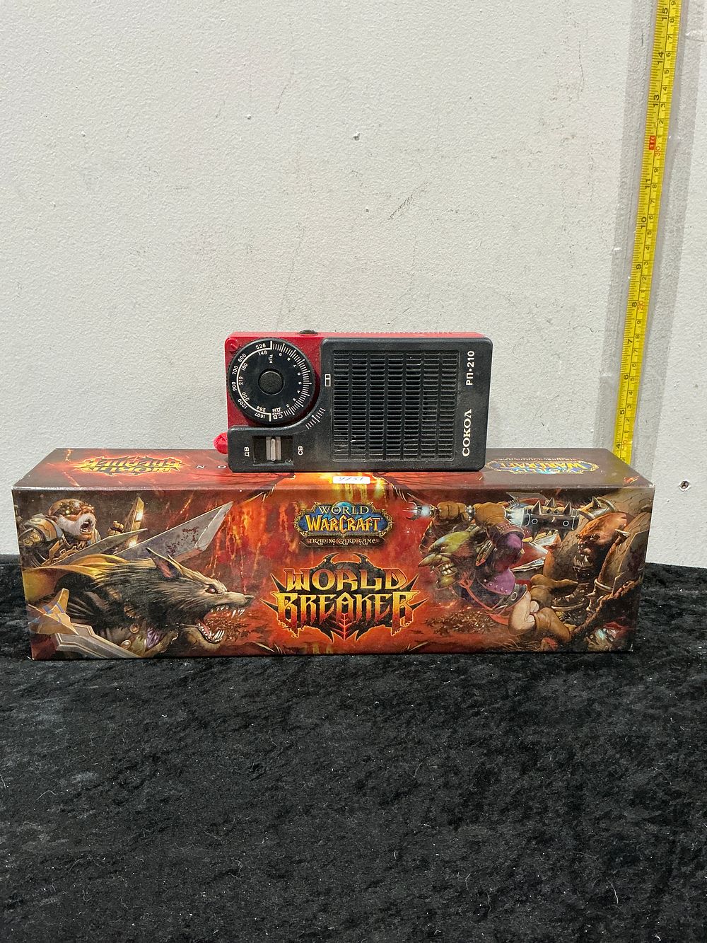 Lot 232: Two Items Comprising a COKOA RP-210 Portable Radio and a World of Warcraft Worldbreaker Trading Card Game Accessory Set