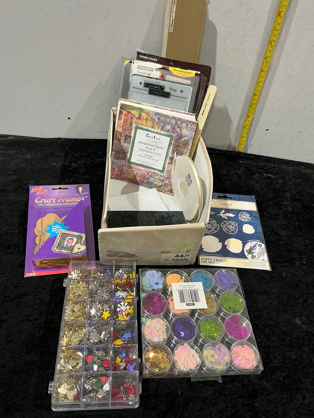 Lot 313: An Assortment of Crafting and Scrapbooking Materials and Tools including Tattered Lace and Fiskars