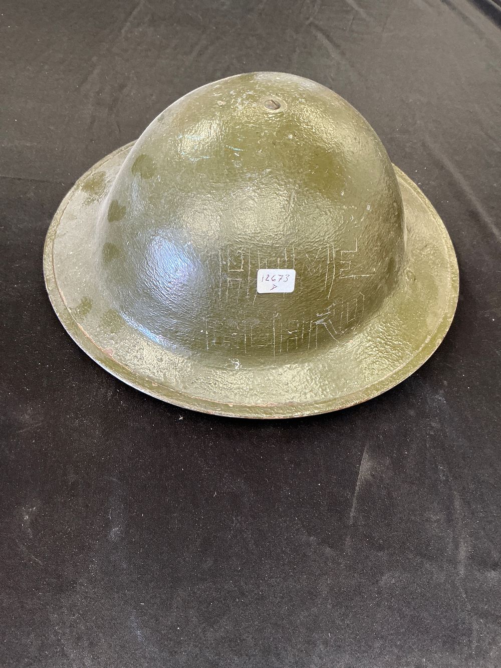 Lot 199: British WWI Mk 1 Steel Helmet with Home Fleet Inscription