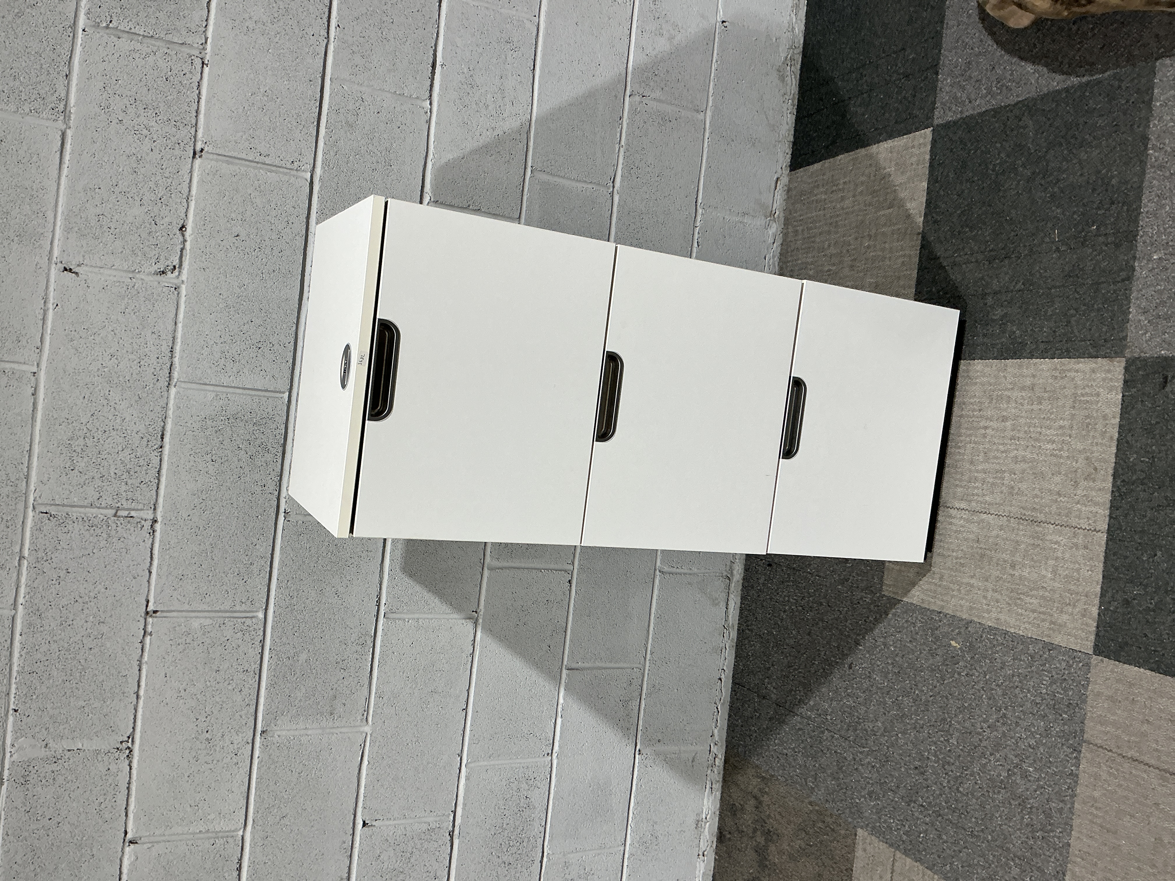 A Bisley Three-Drawer Steel Pedestal Storage Cabinet in White