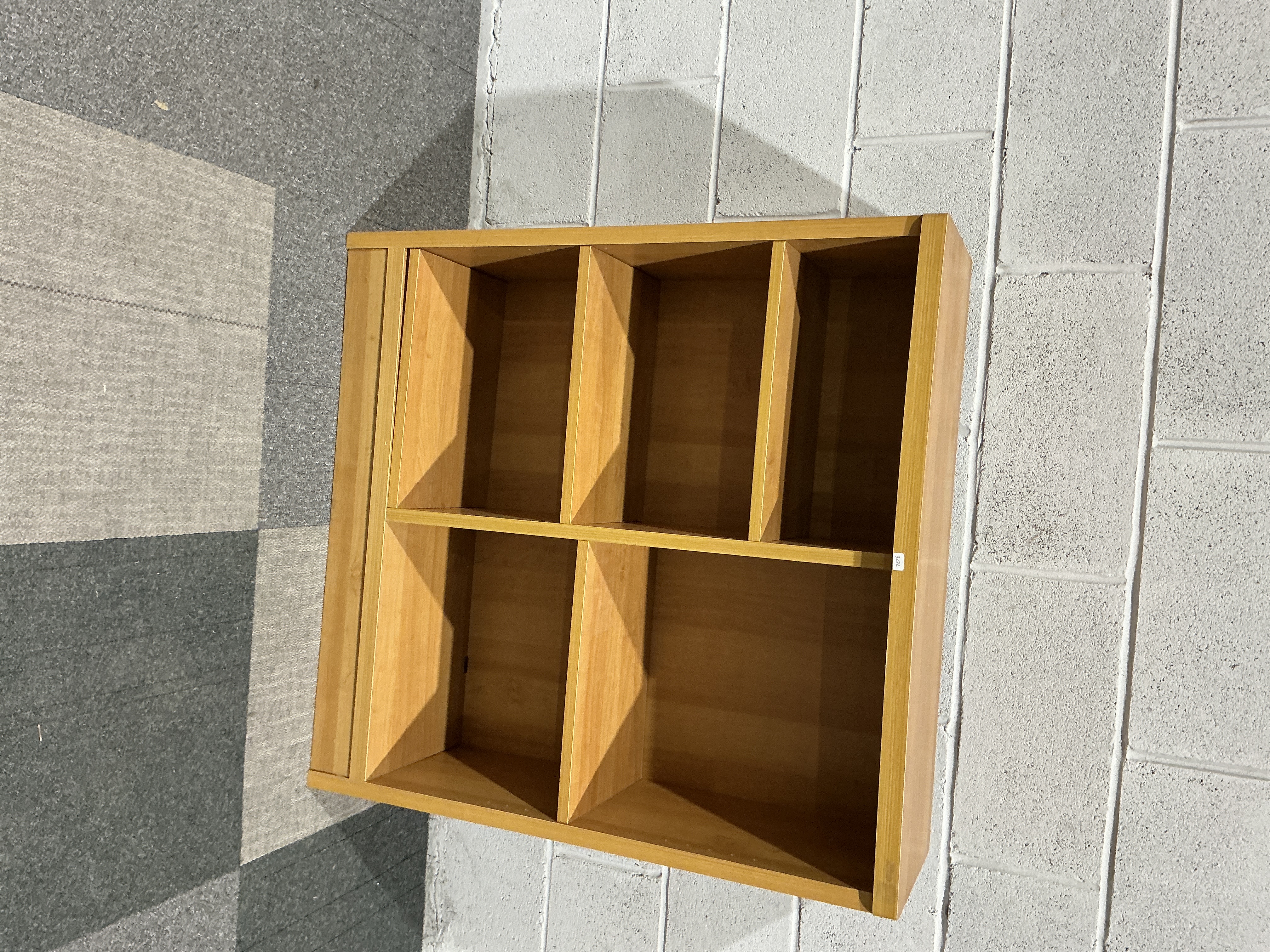 A Modern Five-Compartment Open Shelving Unit in a Light Wood-Effect Finish