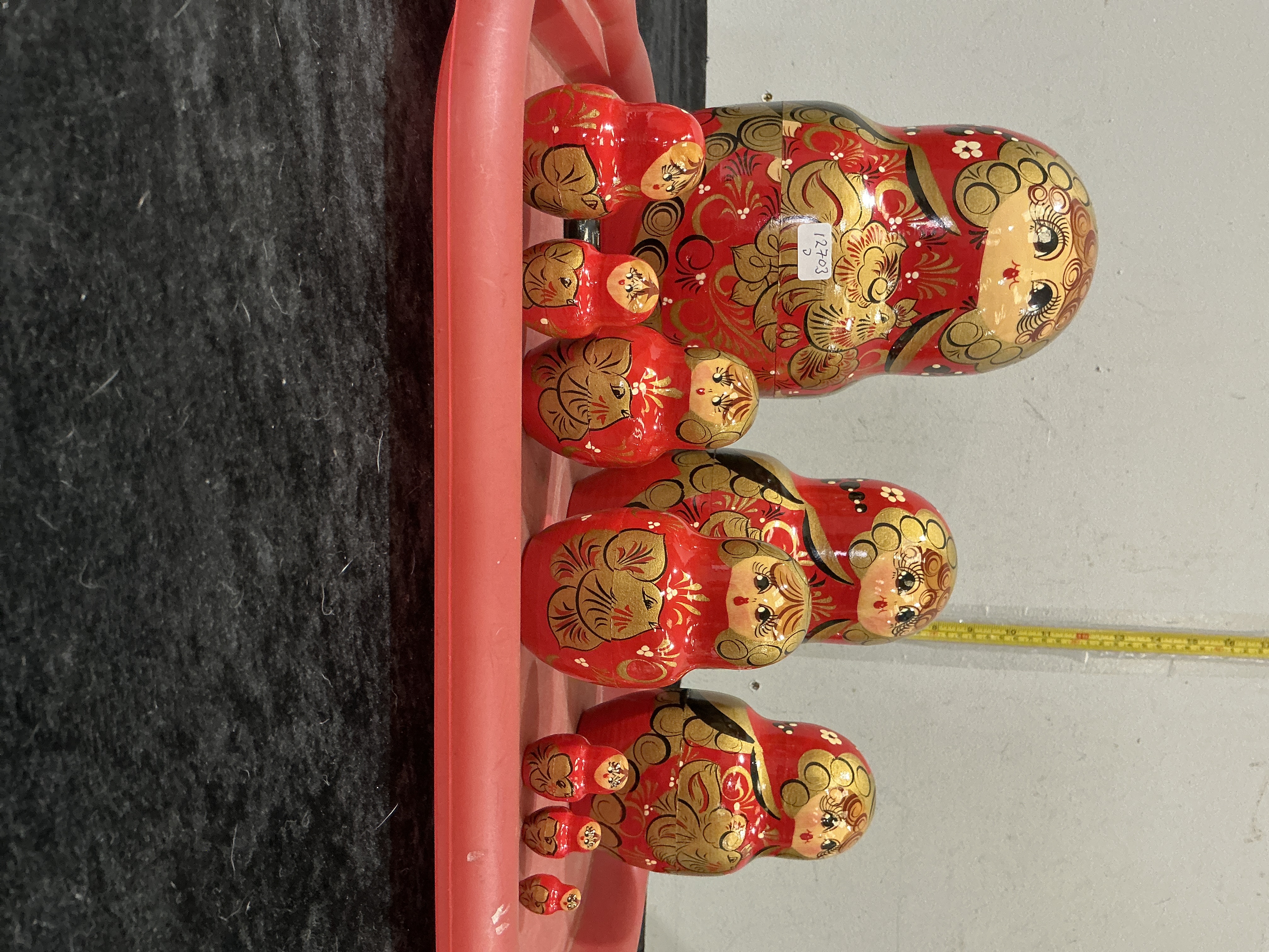 A Set of Nine Russian Khokhloma Style Matryoshka Nesting Dolls