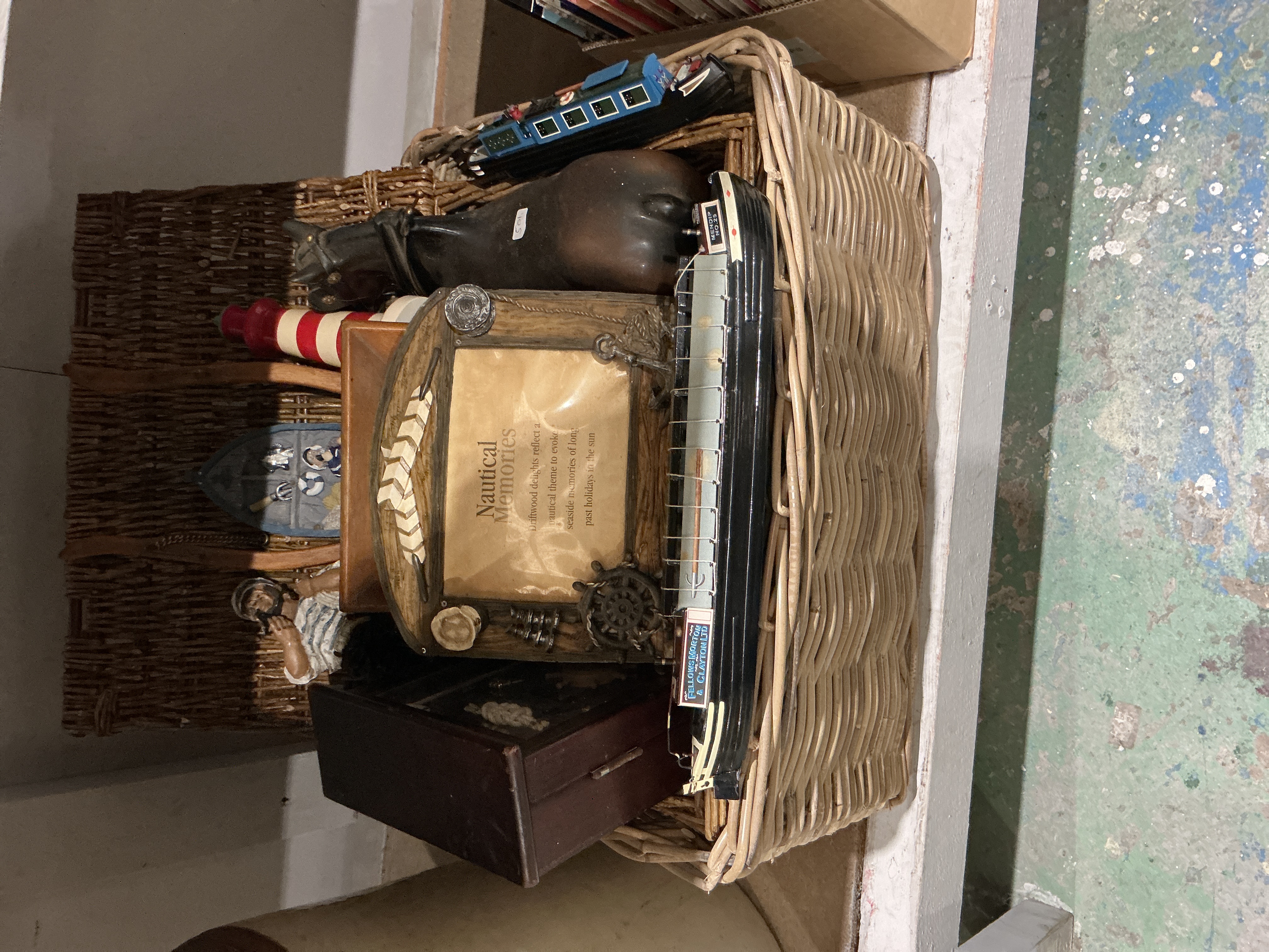 A Collection of Nautical and Transport Memorabilia in a Large Victorian Style Wicker Basket